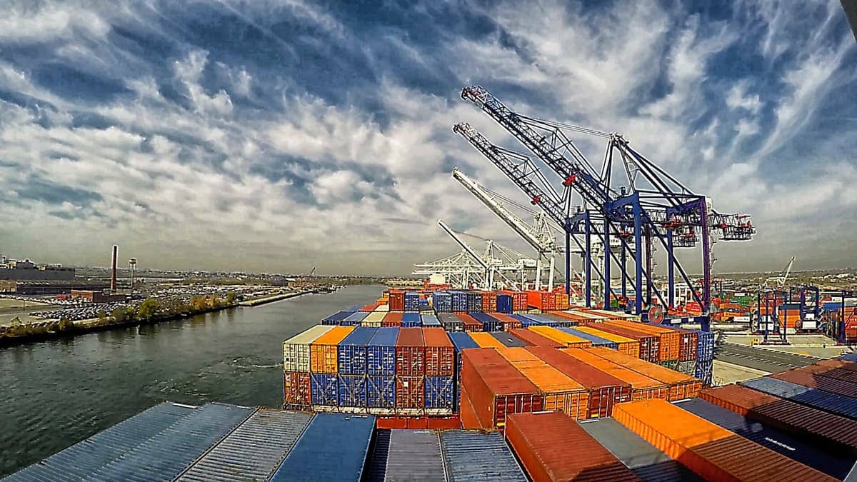 containers and cranes at export terminal port
