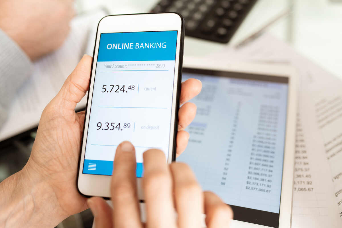Person using a mobile banking app, illustrating modern financial transactions