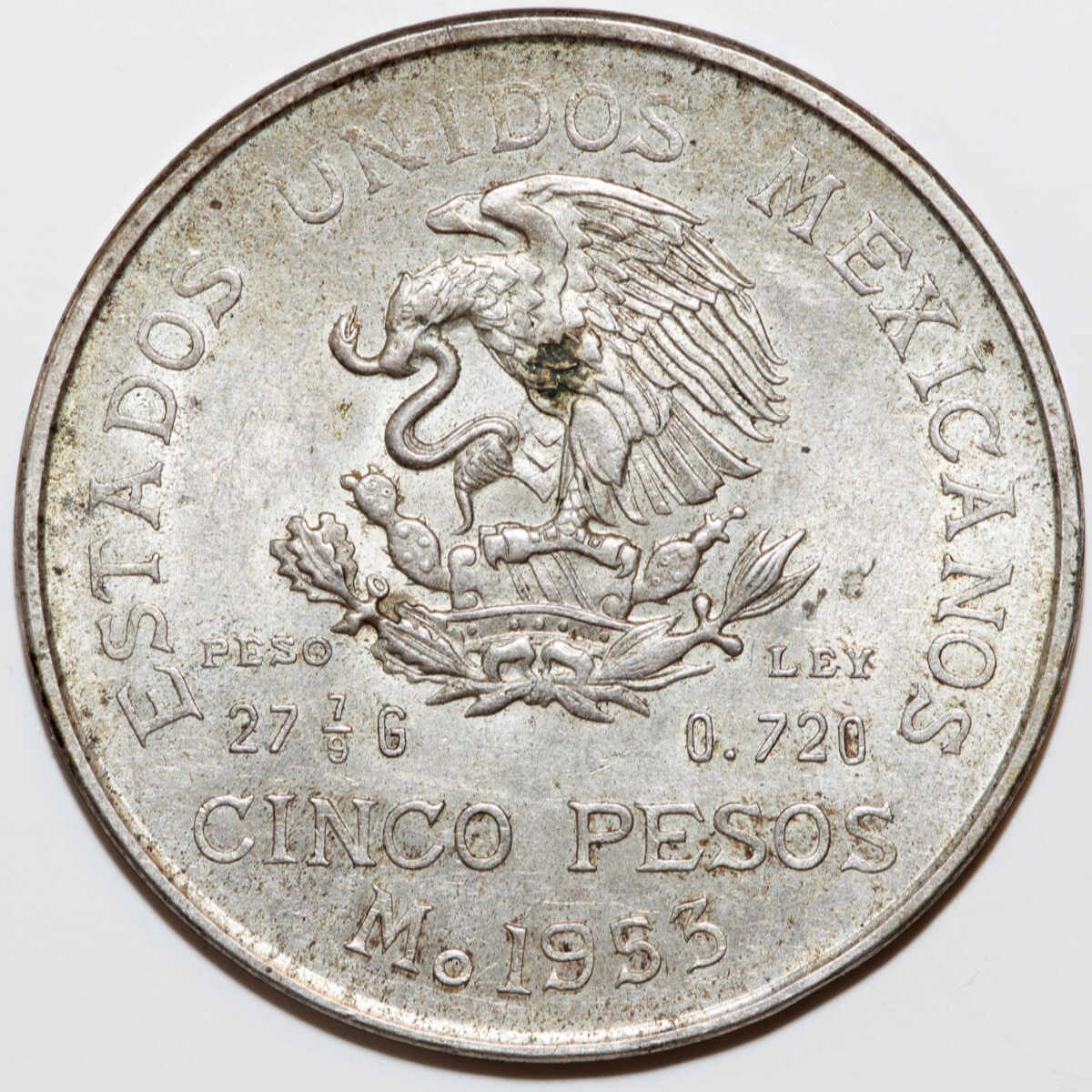 Silver 1953 Mexican coin with eagle emblem, Cinco Pesos.